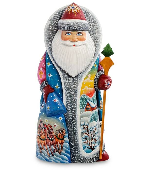Carved Santa Claus figurine with a bag
