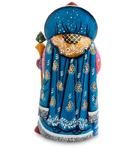 Carved Santa Claus figurine with a bag