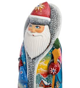 Carved Santa Claus figurine with a bag