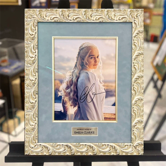 An autographed photo of actress Emilia Clarke