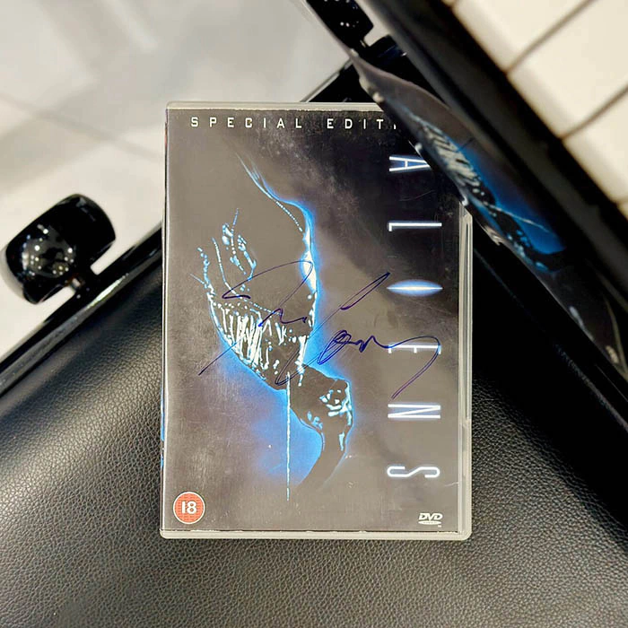 The DVD "Strangers" with an autograph. James Cameron