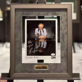 An autographed photo. Larry King