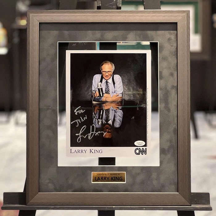 An autographed photo. Larry King