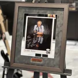 An autographed photo. Larry King