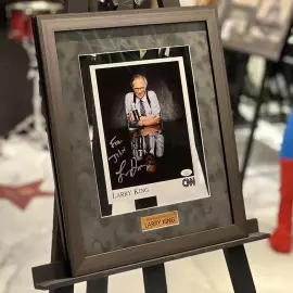 An autographed photo. Larry King