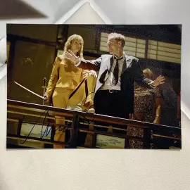 Autographed photos by Quentin Tarantino and Uma Thurman