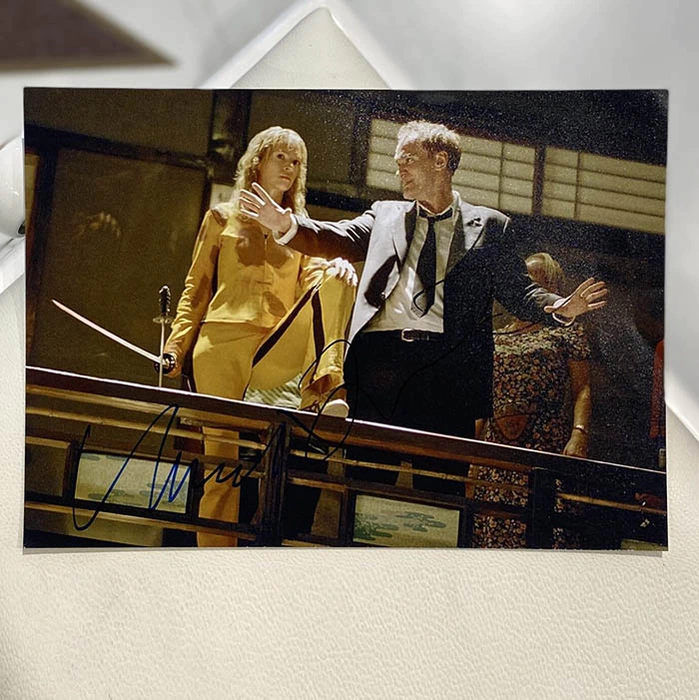 Autographed photos by Quentin Tarantino and Uma Thurman