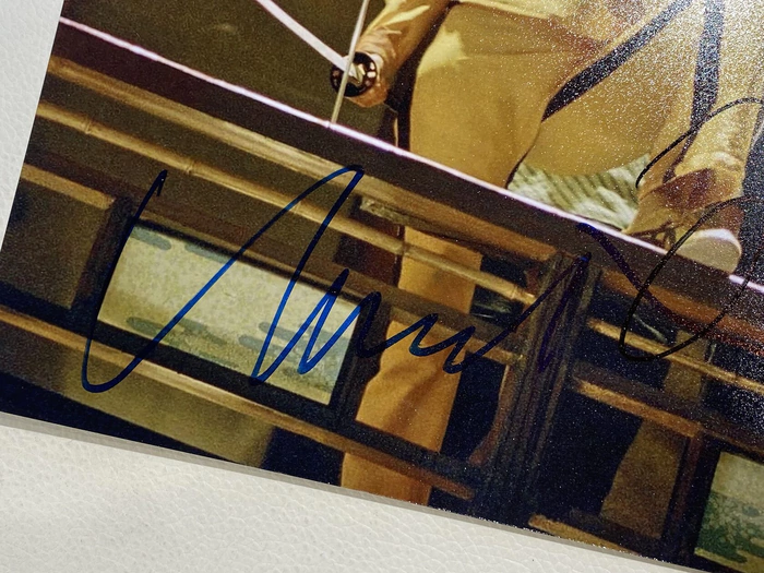 Autographed photos by Quentin Tarantino and Uma Thurman