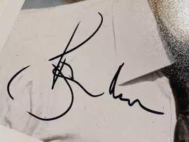 Signed photo by Roger Moore