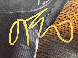 An autographed photo. A shot from the movie "Oz: The Great and Terrible" by James Franco