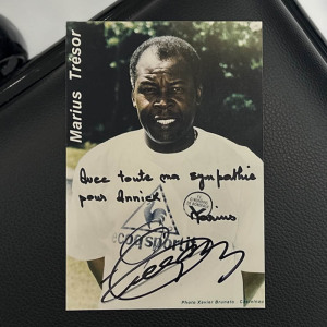 A photo with a handwritten address and an autograph. Marius Trezor