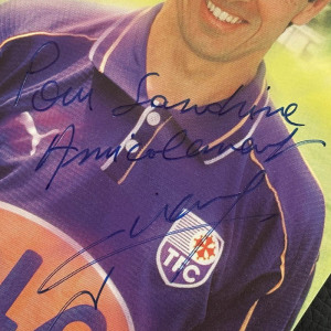 A photo with a handwritten address and an autograph. Alain Giress