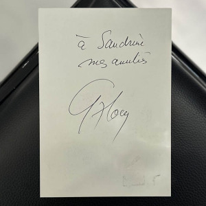 An autographed photo. Guy Ru