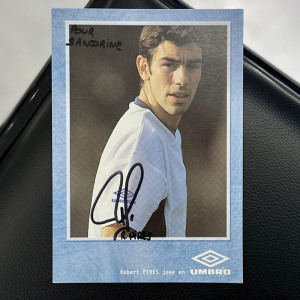 An autographed photo. Robert Pires