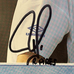 An autographed photo. Robert Pires