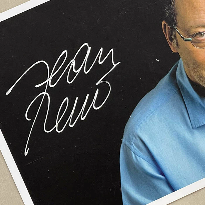 An autographed photo. Jean Renaud