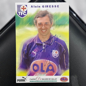 A photo with a handwritten address and an autograph. Alain Giress