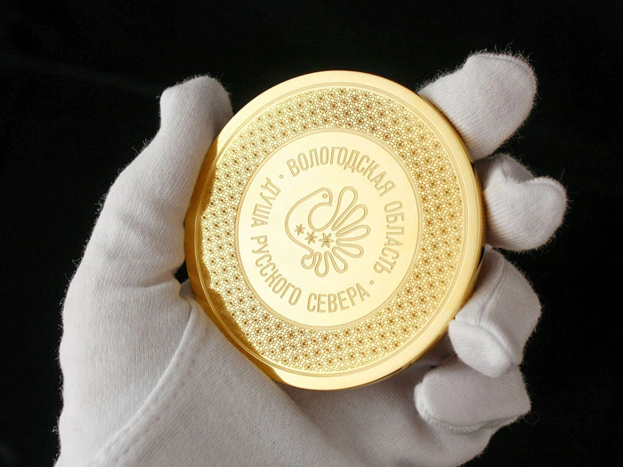 Corporate medal on an acrylic stand