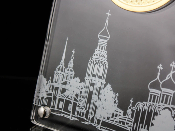 Corporate medal on an acrylic stand
