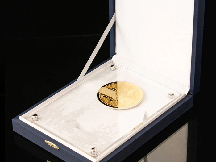 Corporate medal on an acrylic stand