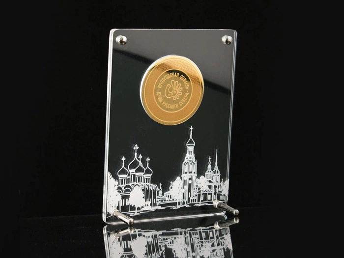 Corporate medal on an acrylic stand