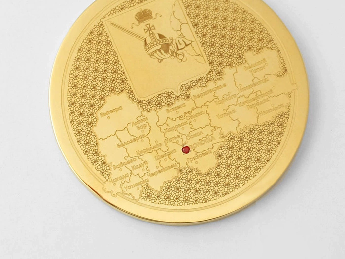 Corporate medal on an acrylic stand