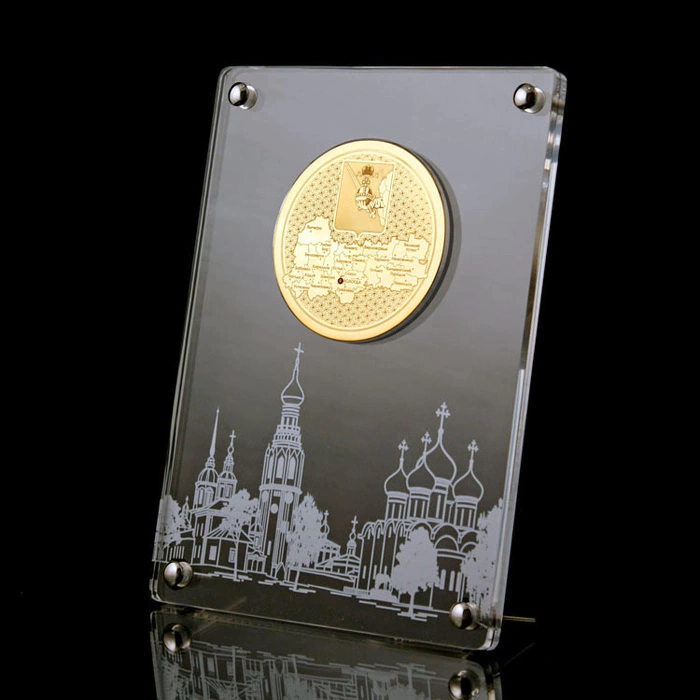 Corporate medal on an acrylic stand