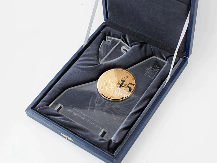 Corporate medal on an acrylic stand