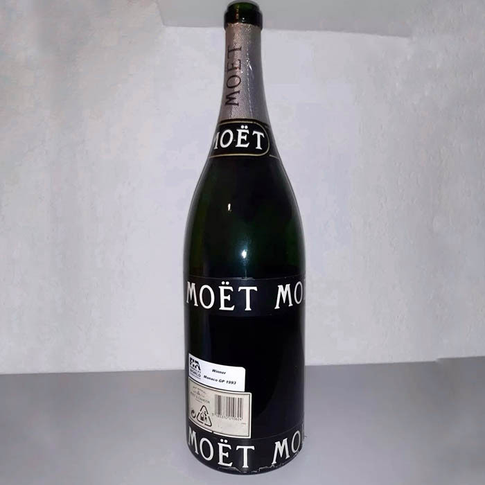 A bottle of Moet used by racer Ayrton Senna during the award ceremony at the Monaco GP with an autograph, 1993