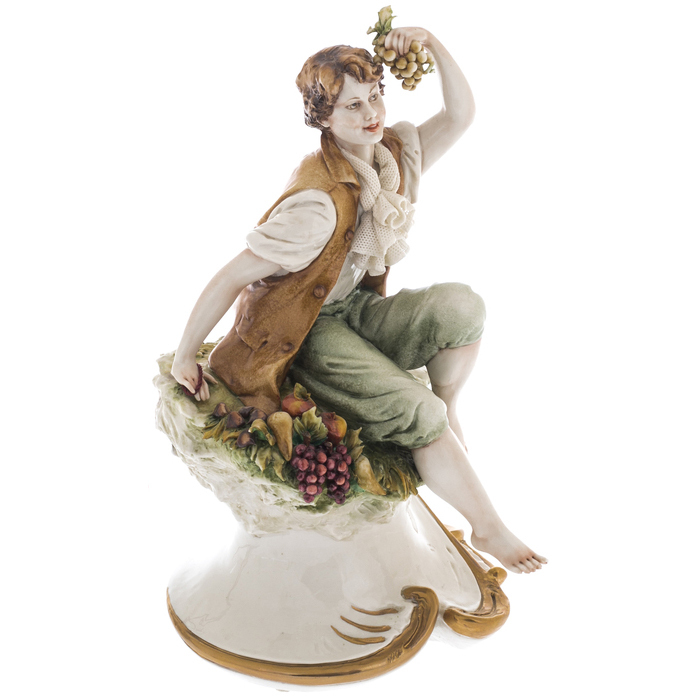 Statuette "Young man with fruits"