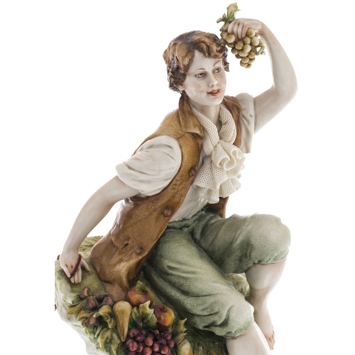Statuette "Young man with fruits"