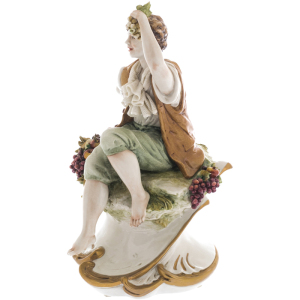 Statuette "Young man with fruits"