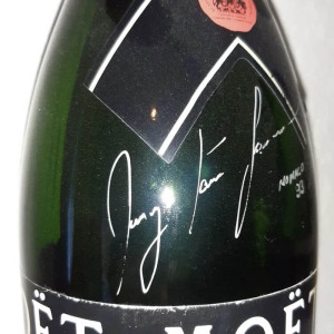 A bottle of Moet used by racer Ayrton Senna during the award ceremony at the Monaco GP with an autograph, 1993