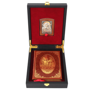 A leather-bound book "Prayer Book of an Orthodox Cossack" with an icon of the "Kazan Mother of God"