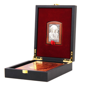 A leather-bound book "Prayer Book of an Orthodox Cossack" with an icon of the "Kazan Mother of God"