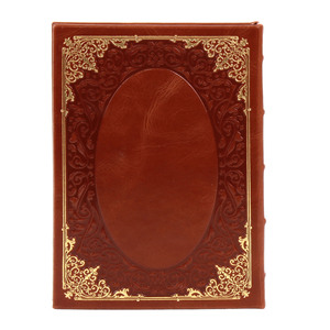 A leather-bound book "Prayer Book of an Orthodox Cossack" with an icon of the "Kazan Mother of God"