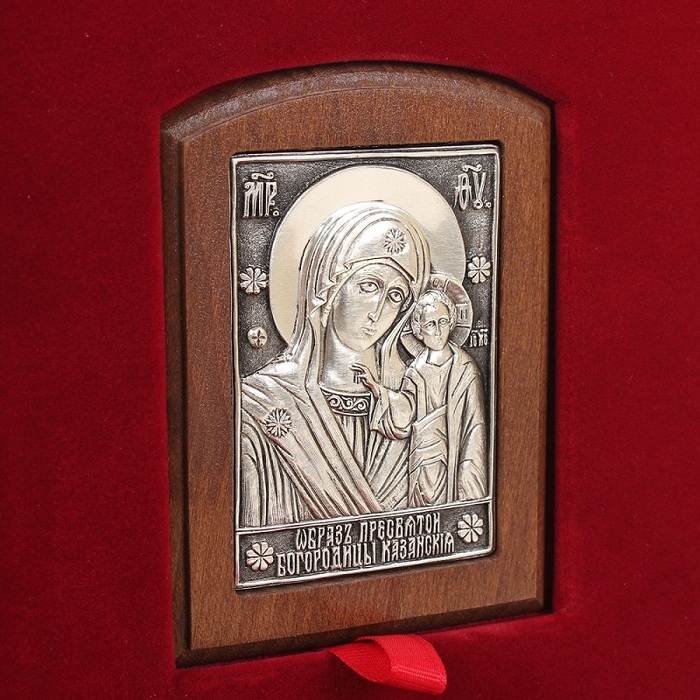 A leather-bound book "Prayer Book of an Orthodox Cossack" with an icon of the "Kazan Mother of God"