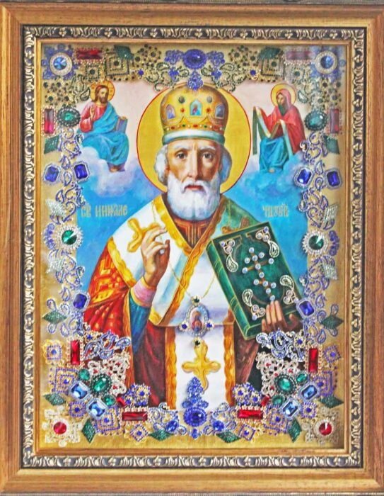 The icon with precious stones "Nicholas the Wonderworker" is gilded