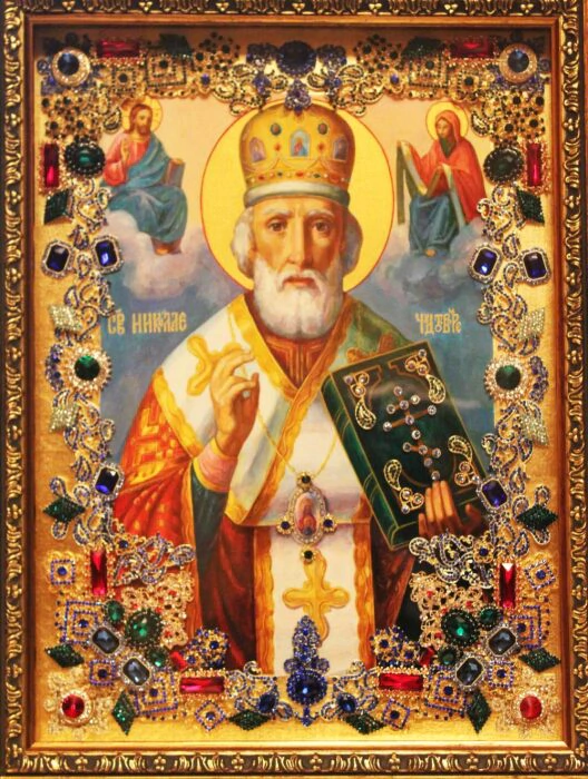 The icon with precious stones "Nicholas the Wonderworker" is gilded