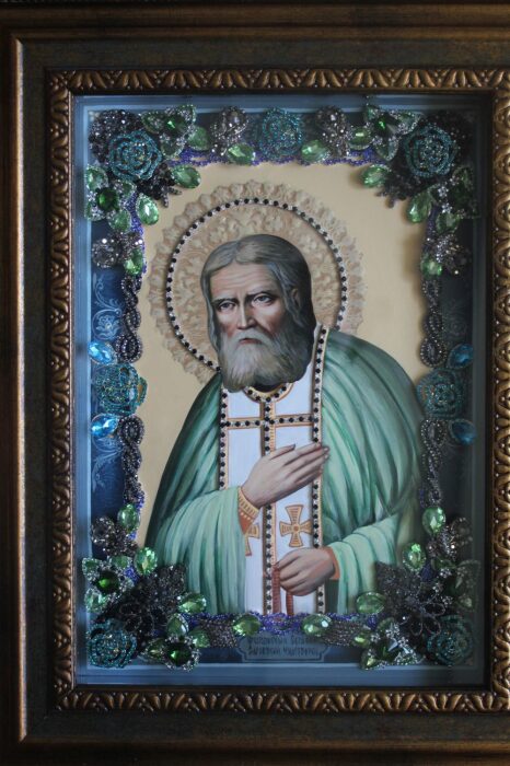 The icon with precious stones "St. Seraphim of Sarov" is gilded