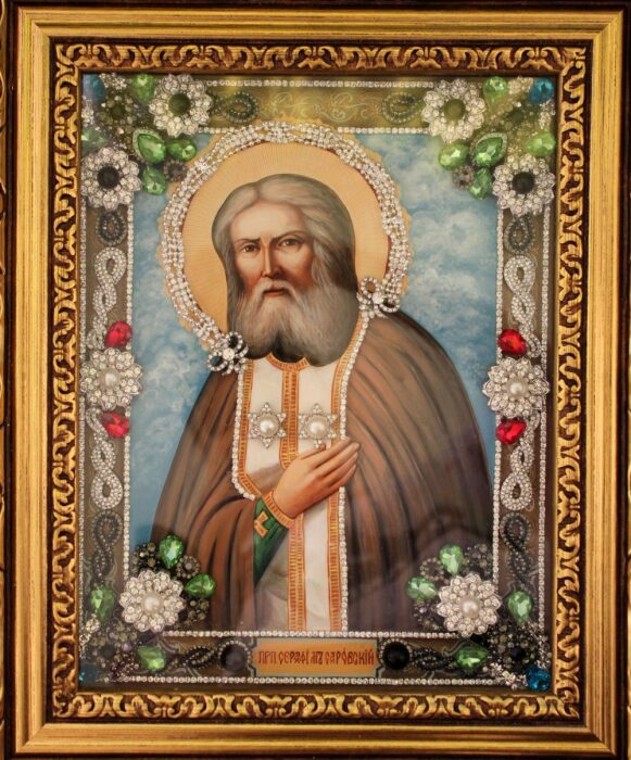 The icon with precious stones "St. Seraphim of Sarov" with pearls is gilded