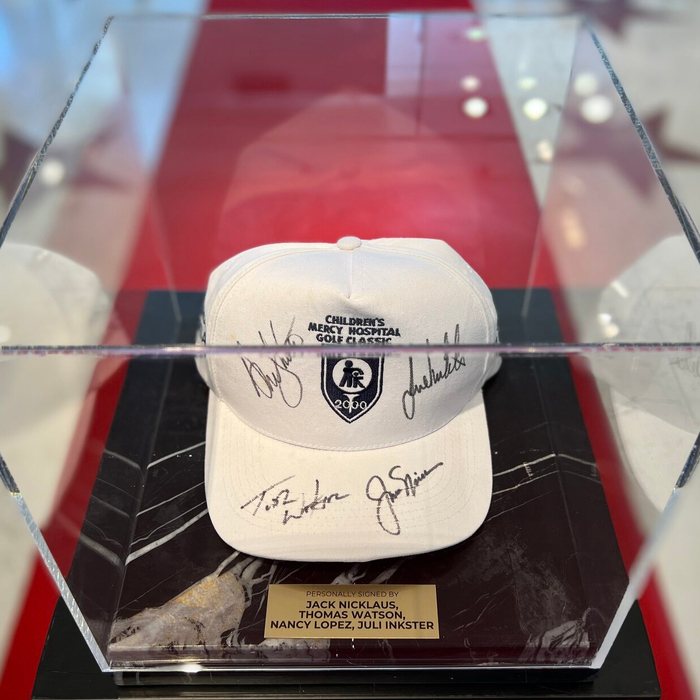 Cap with autographs of golfers Jack Nicklaus, Tom Watson, Nancy Lopez, Julie Inkster, black marble
