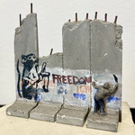 Banksy art object on an authentic element of the Israeli-Palestinian Wall