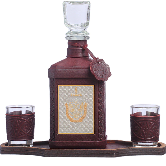A decanter in a leather cover "FSB-3" with an overlay