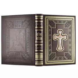 The leather-bound book "The Holy Gospel" in a gift box