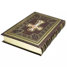The leather-bound book "The Holy Gospel" in a gift box