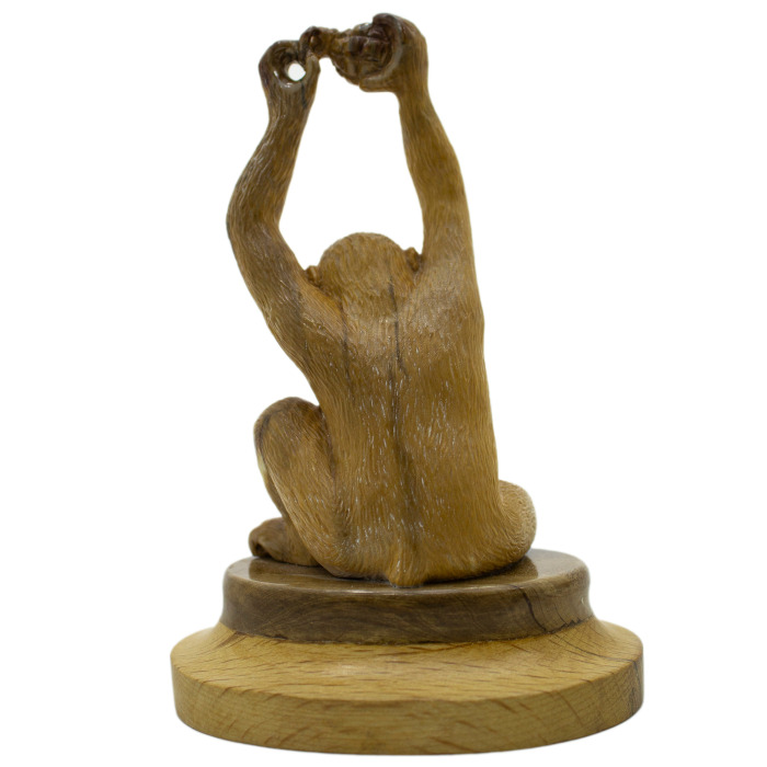 Mammoth tusk sculpture "Monkey with a grenade"