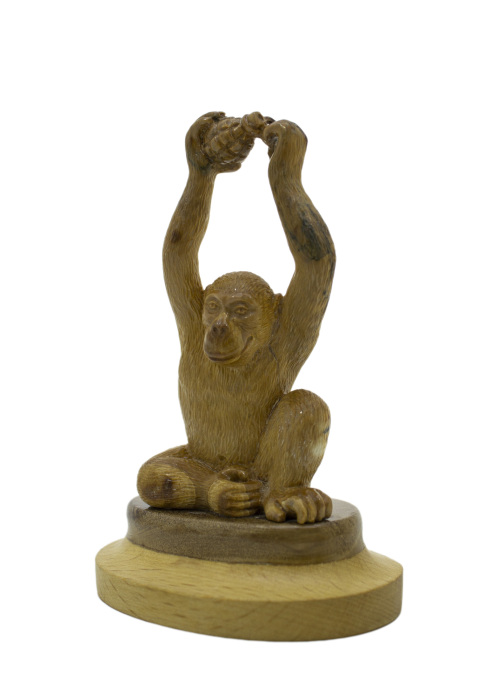 Mammoth tusk sculpture "Monkey with a grenade"