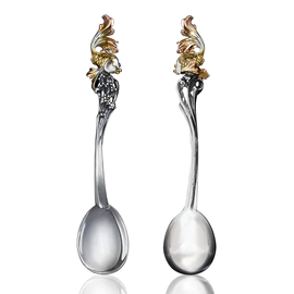 Collection of silver "Goldfish" with cup holder, spoon and napkin holder
