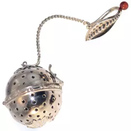 Чайное ситечко из серебра с янтарем